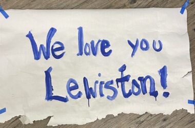 A poster that reads "We love you Lewiston."