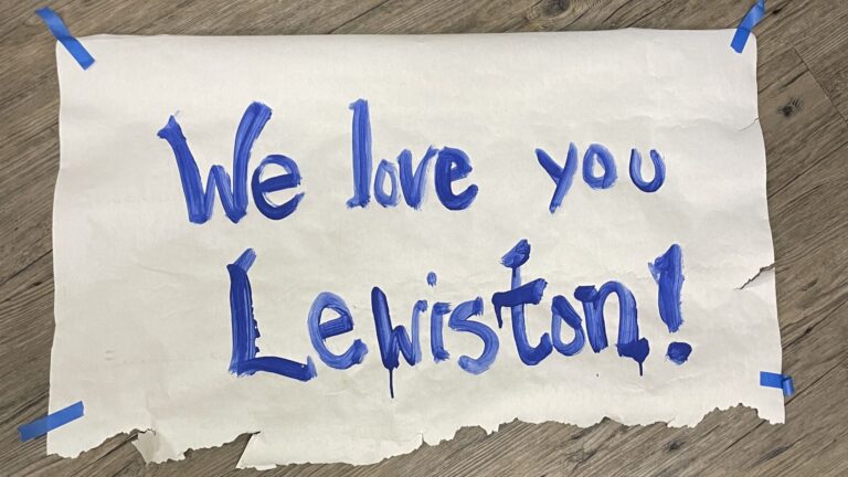 A poster that reads "We love you Lewiston."