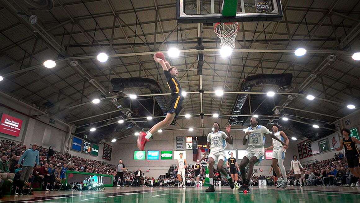 Cooper Flagg prepares to throw down a dunk during a basketball game.