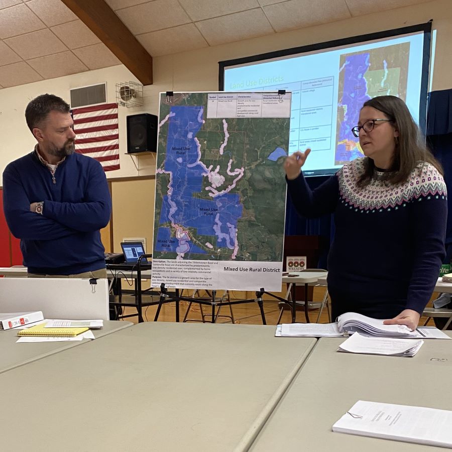 Noel Musson and Aga Dixon seen during a presentation at a meeting.
