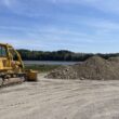 a bulldozer begins working along the trail