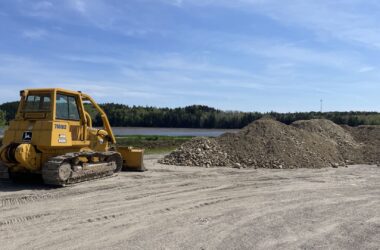 a bulldozer begins working along the trail