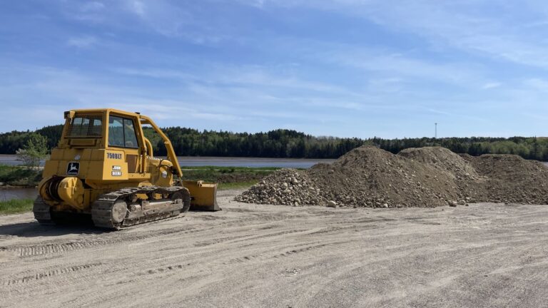 a bulldozer begins working along the trail