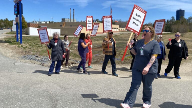 A small group of picketing nurses.