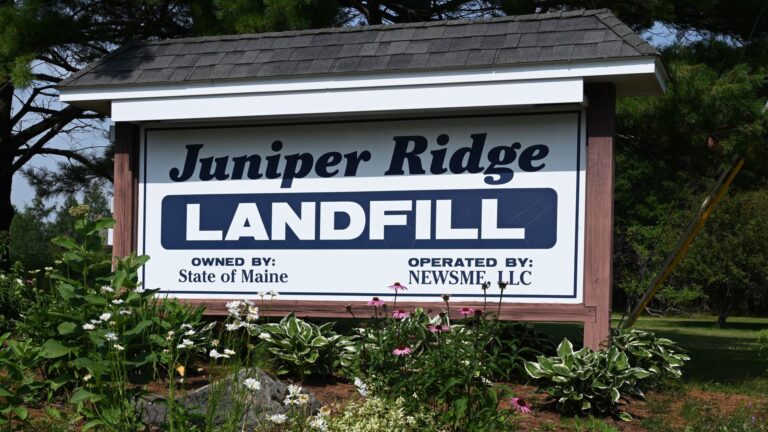 Sign at the entrance of the Juniper Ridge landfill. The sign reads Juniper Ride Landfill owned by State of Maine Operated By NewsMe, LLC.