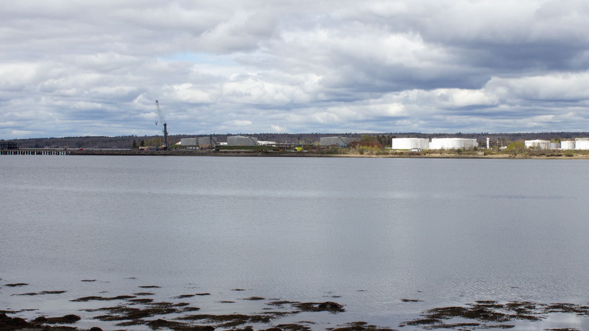 Across the water, the Mack Point facility can be seen.