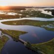 An aerial photo of the Scarborough marsh at sunrise.