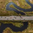 Cars travel along Route 1, which is surrounded on both sides by the Scarborough Marsh.