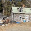 Exterior of a run-down, abandoned house.