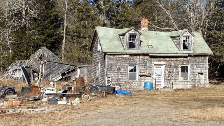 Exterior of a run-down, abandoned house.