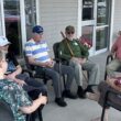 A group of Aroostook memory center patients sit in a circle.