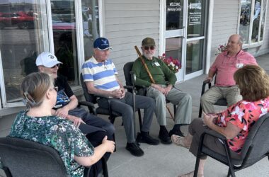 A group of Aroostook memory center patients sit in a circle.