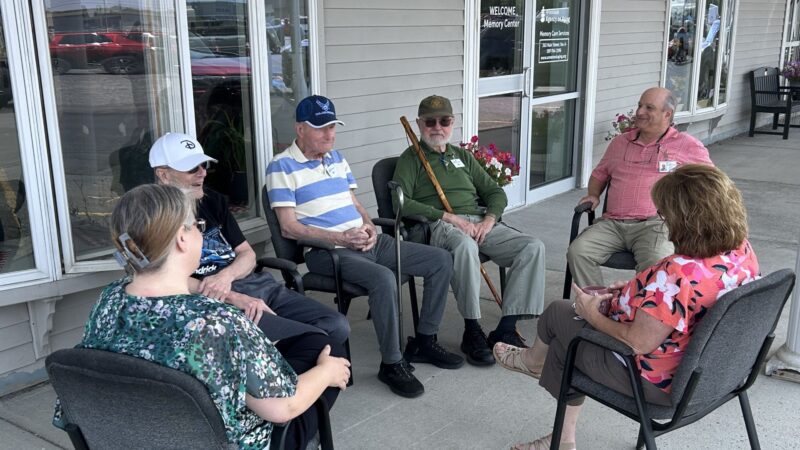 A group of Aroostook memory center patients sit in a circle.