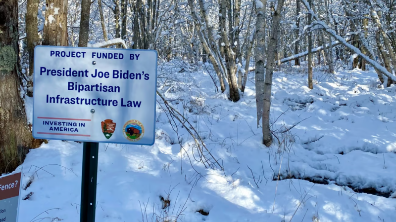 A sign that notes the area is being developed thanks to funding from President Biden's infrastructure law.