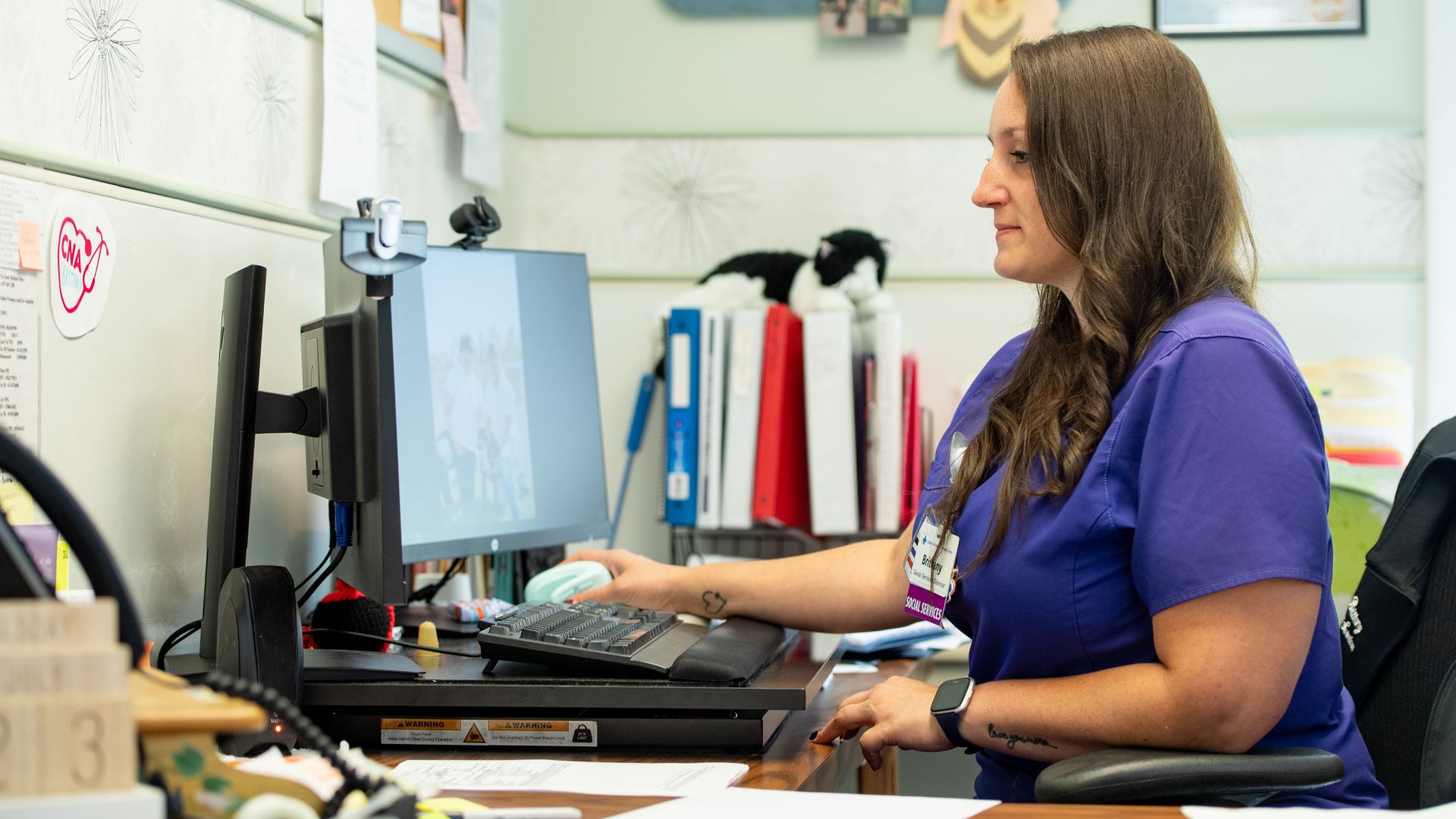 Brittany Trombley seen working at her desk.