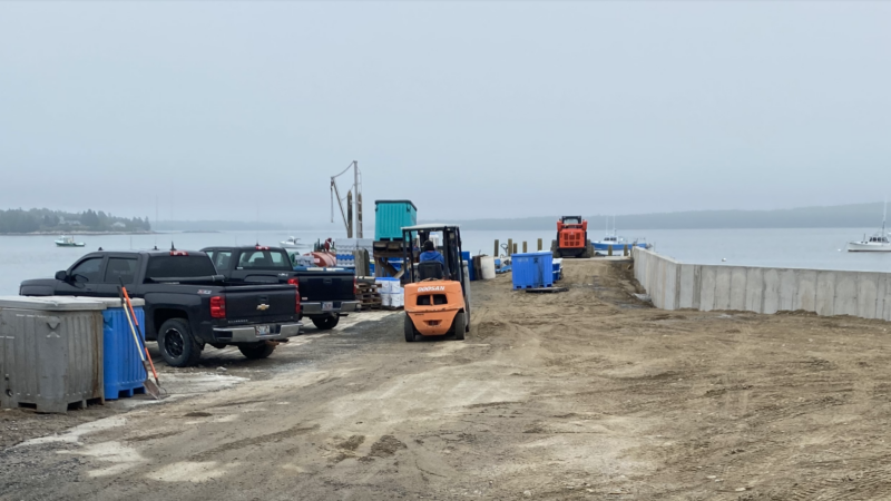 Construction crew at work on rebuilding the pier at Chipman's Wharf.