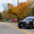 A Lewiston police cruiser is seen in the middle of a roadway.