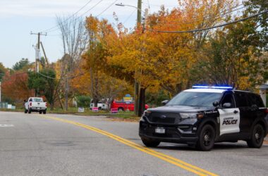 A Lewiston police cruiser is seen in the middle of a roadway.