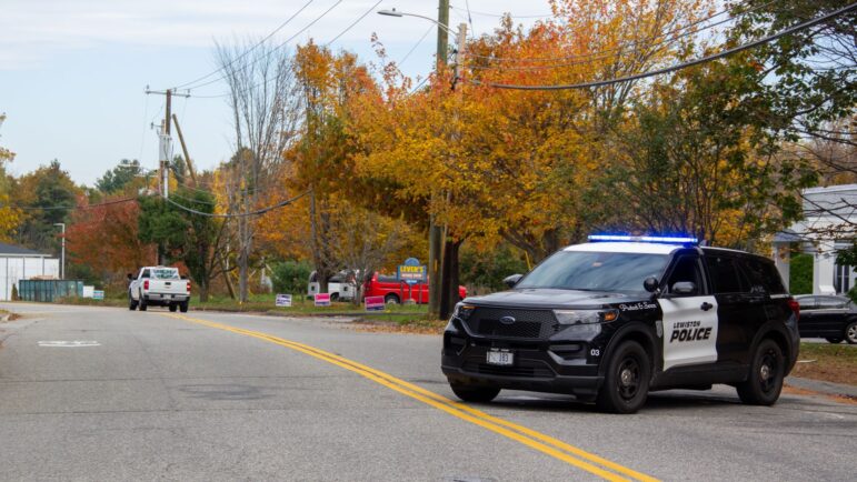 A Lewiston police cruiser is seen in the middle of a roadway.