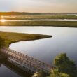 An aerial photo of a bridge across the Scarborough marsh.