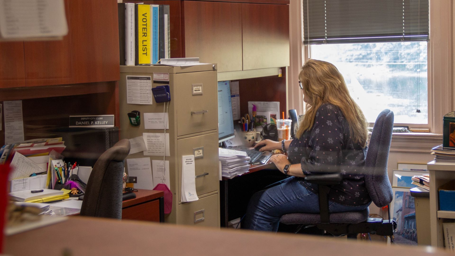 Lisa Gilliam working at her desk.