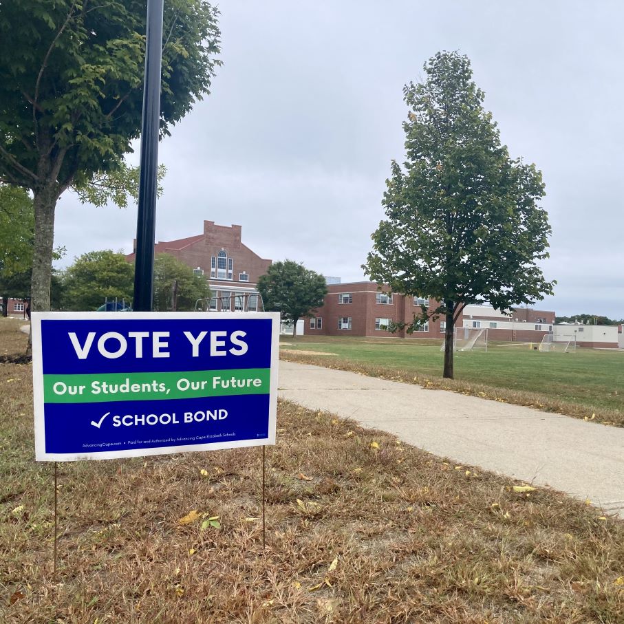 A sign encouraging voters to approve the school bond measure.