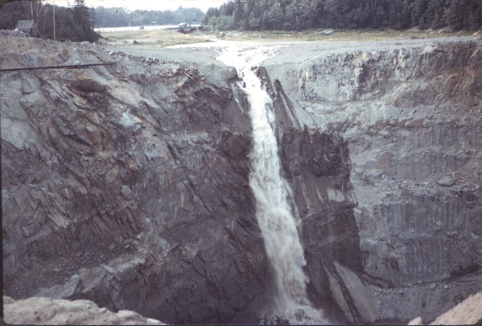 A waterfall into the open Callahan mine pit