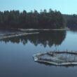 Salmon pens sit above the water