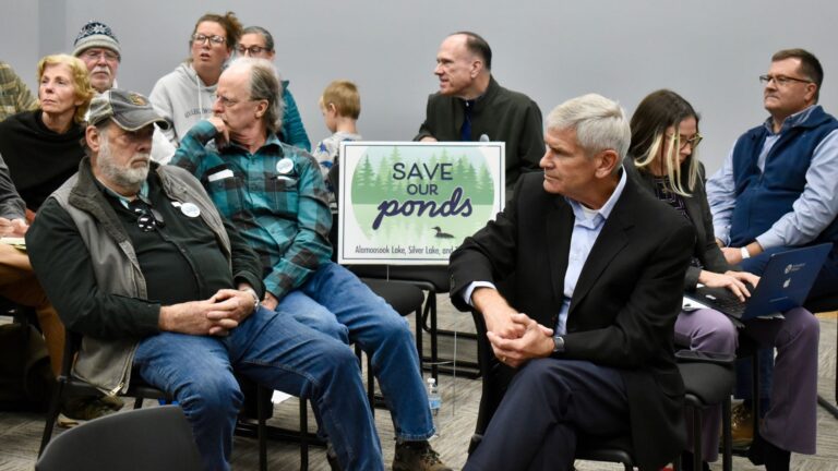 A group of people attend a hearing in Bucksport.