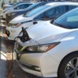 a row of electric vehicles charging.