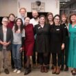 members of the newsroom pose for a group photo.