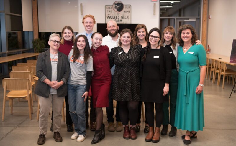 members of the newsroom pose for a group photo.