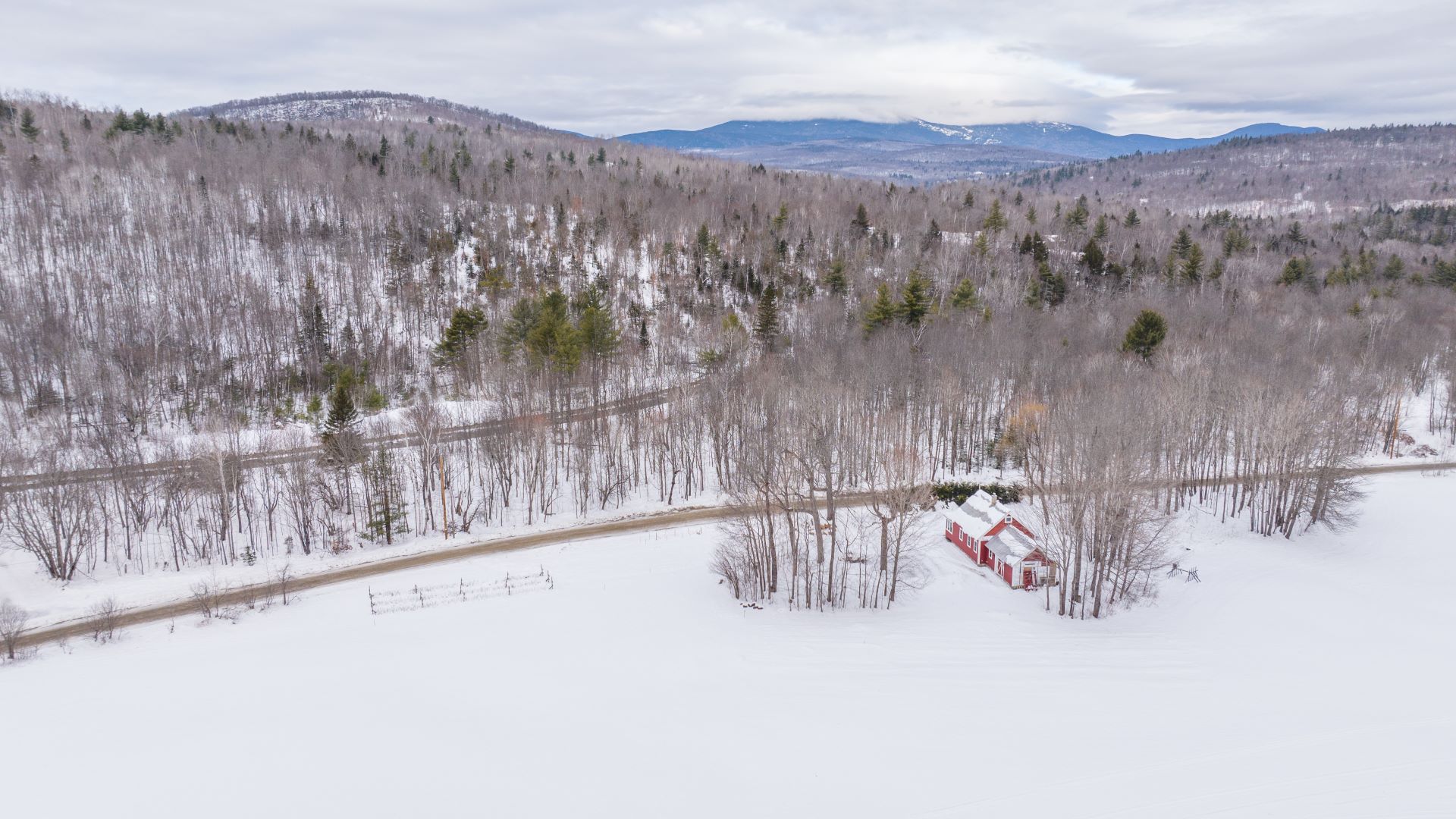 aerial view of a house by the river.