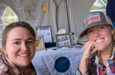 SAFE Maine workers pose for a selfie while tabling at the Common Ground Fair.