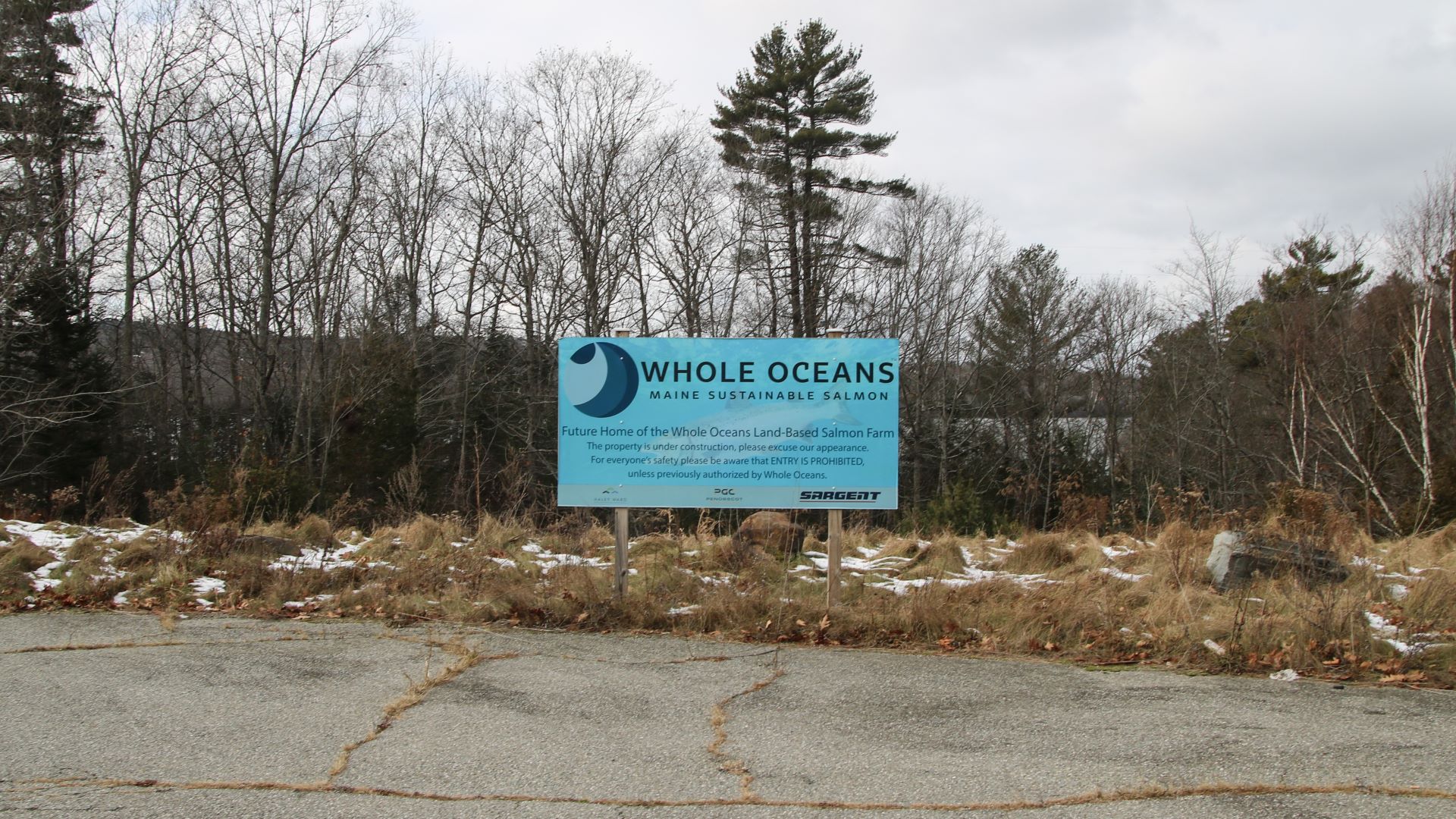 a sign touting the future home of the Whole Ocean salmon farm.