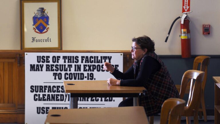 Sue Mackey Andrews talks during a municipal meeting.