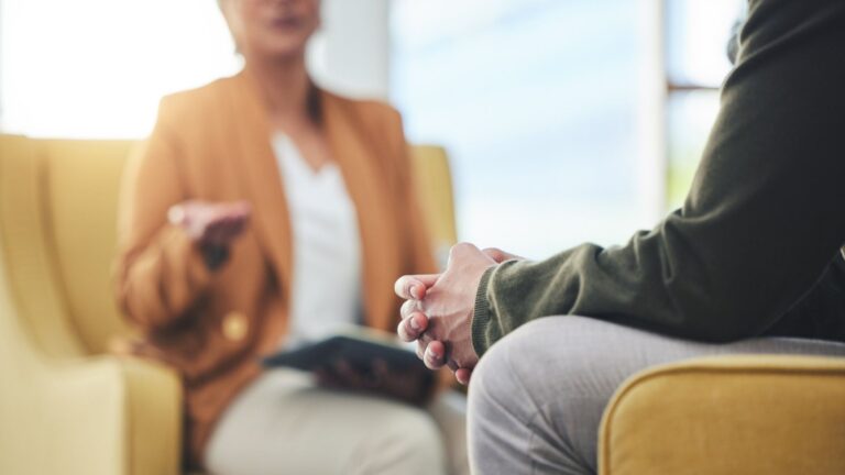 a patient speaks with a therapist.