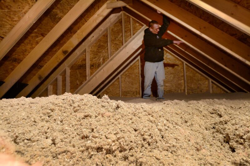 Michael McDonald standing in an attic.