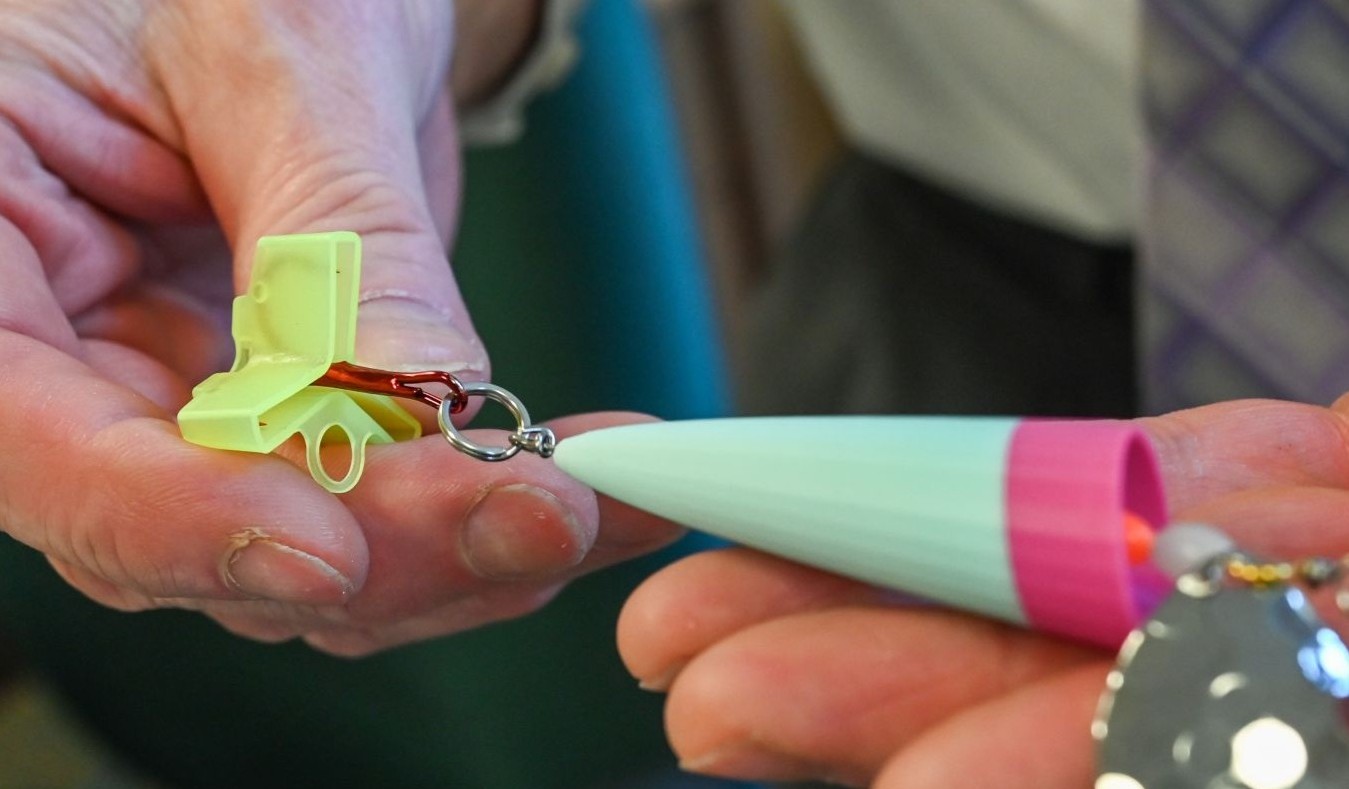 fishing lure held in hands.