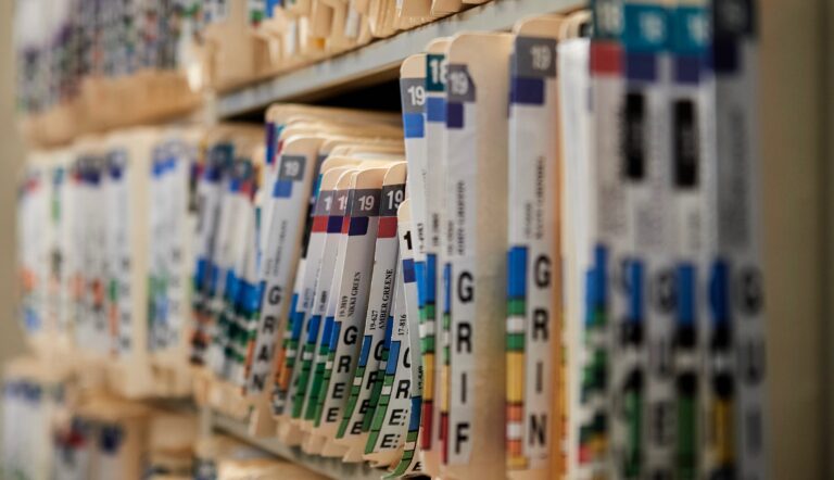court case files on a shelf.
