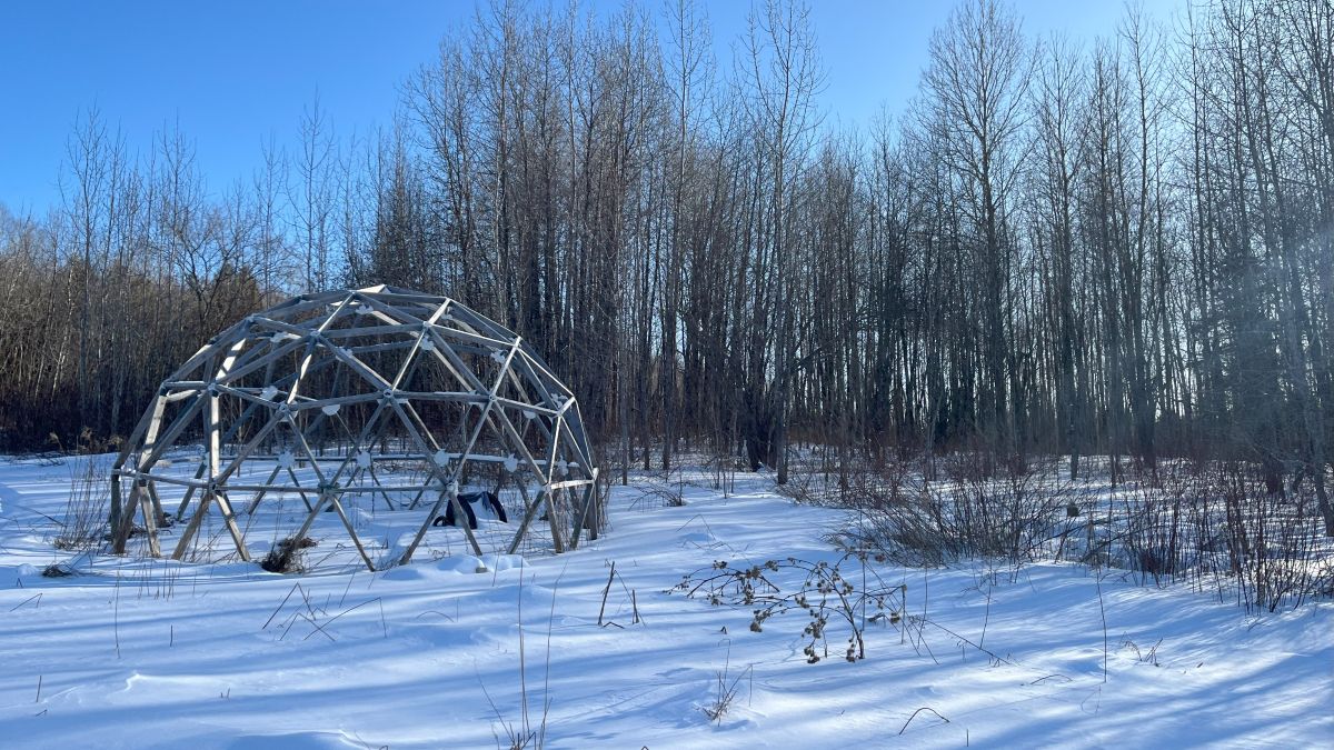 makeshift yurt in snow-covered land.