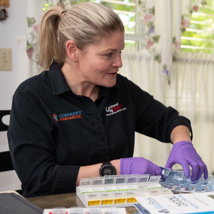 a community paramedic at work in a patient's home.