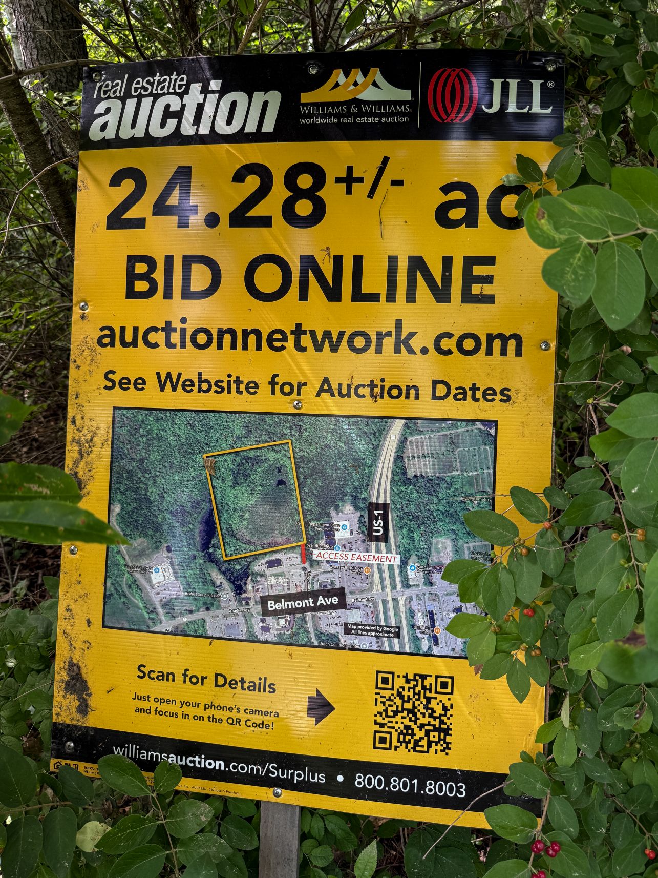 an auction sign at the belfast wetlands.