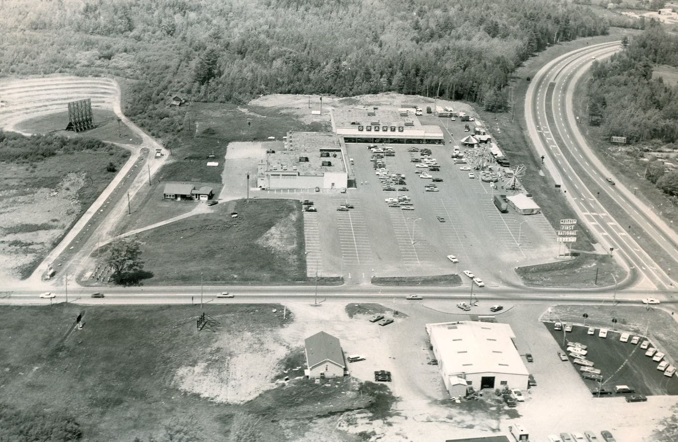 aerial view from the 1960s of the drive in and dealership.