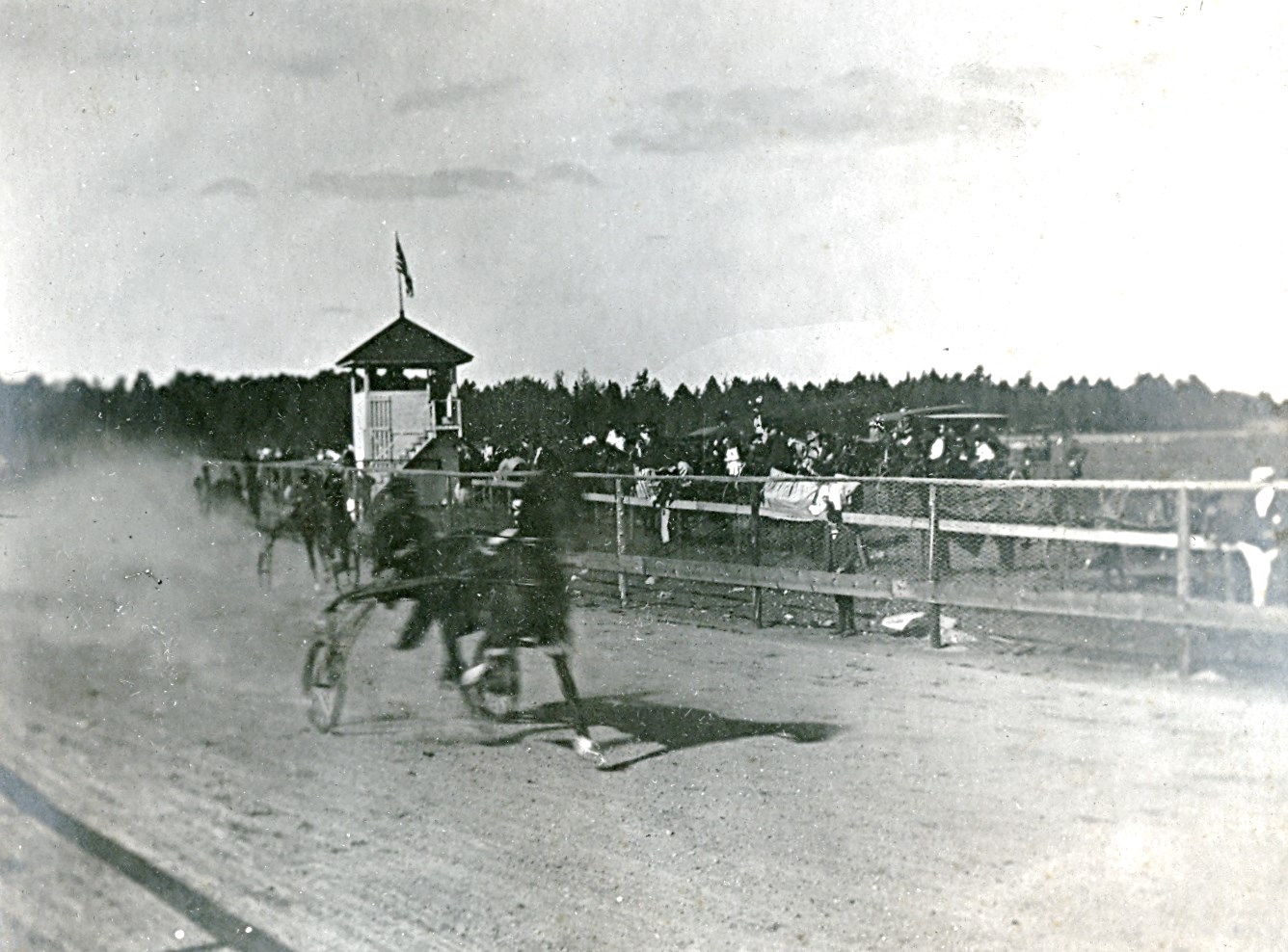 old photo of horse race.