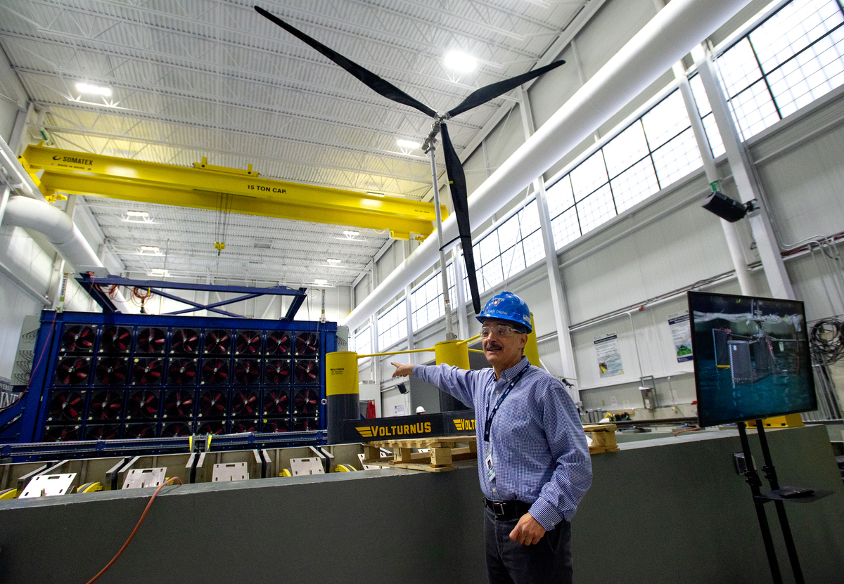 Habib Dagher points at construction of an offshore wind turbine.