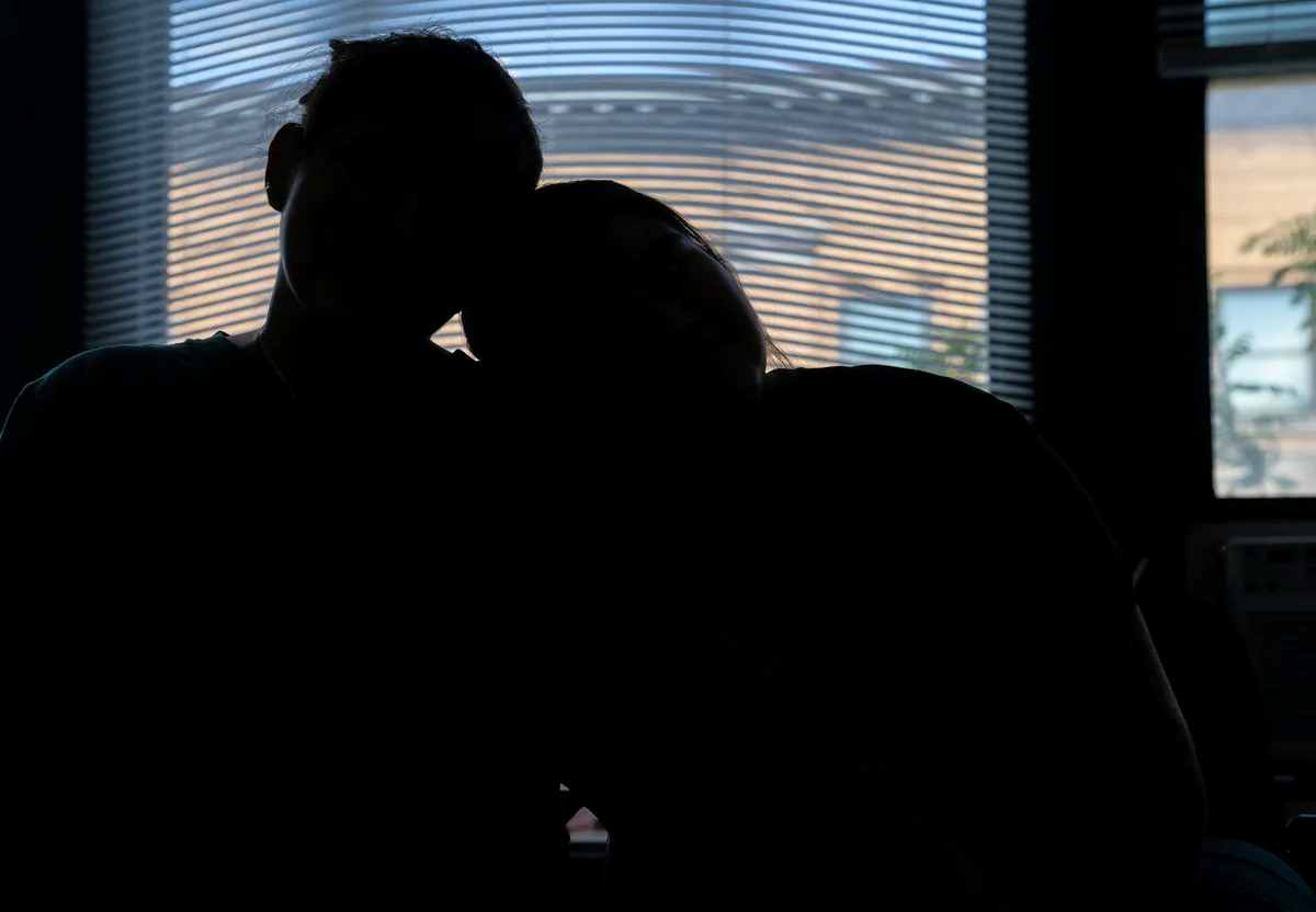 silhouette image of a mother and daughter.