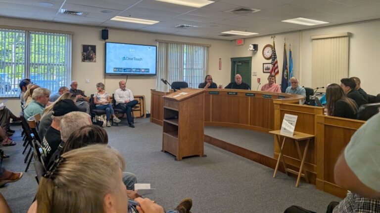 citizens and commissioners at a town meeting.