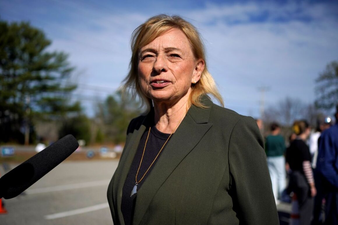 Janet Mills speaks with reporters.