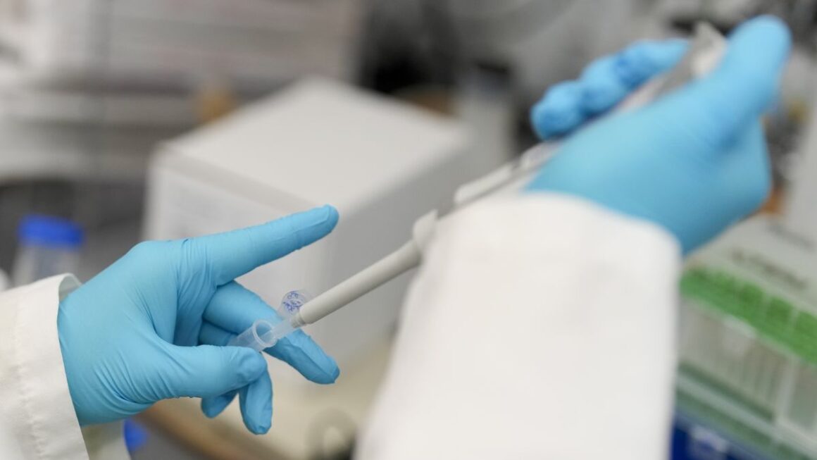 A researcher conducts a test in a research lab.